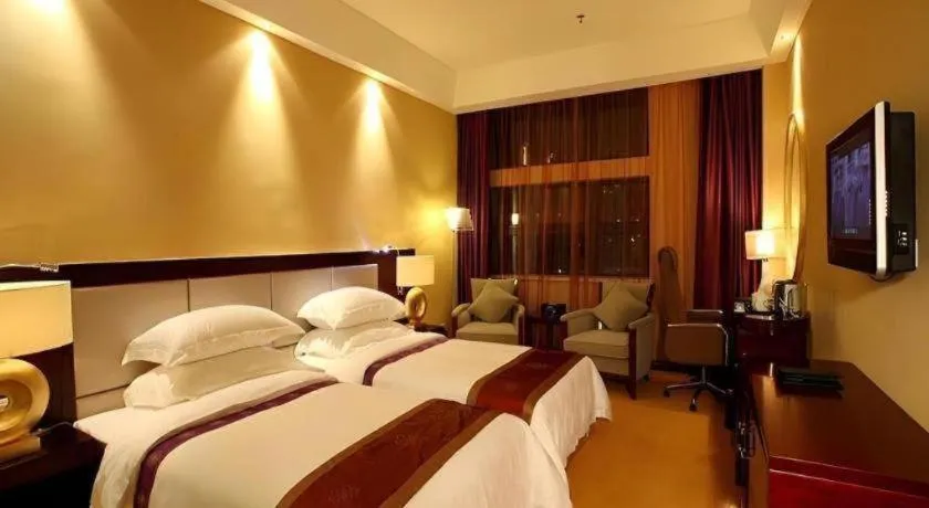 Bed in Chuanghui Business Hotel