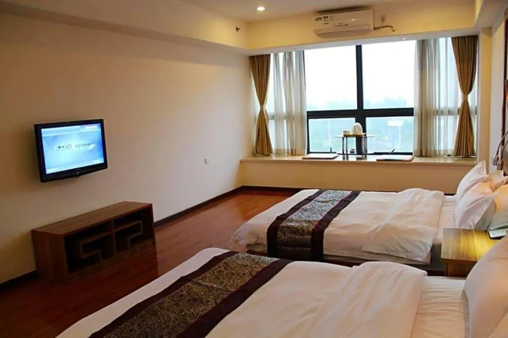 Bed in Chuanghui Business Hotel