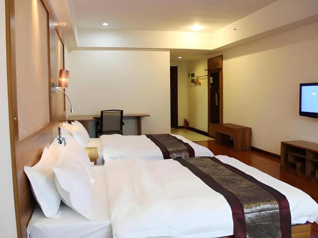 Bed in Chuanghui Business Hotel