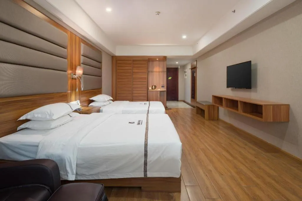 Bed in Chuanghui Business Hotel