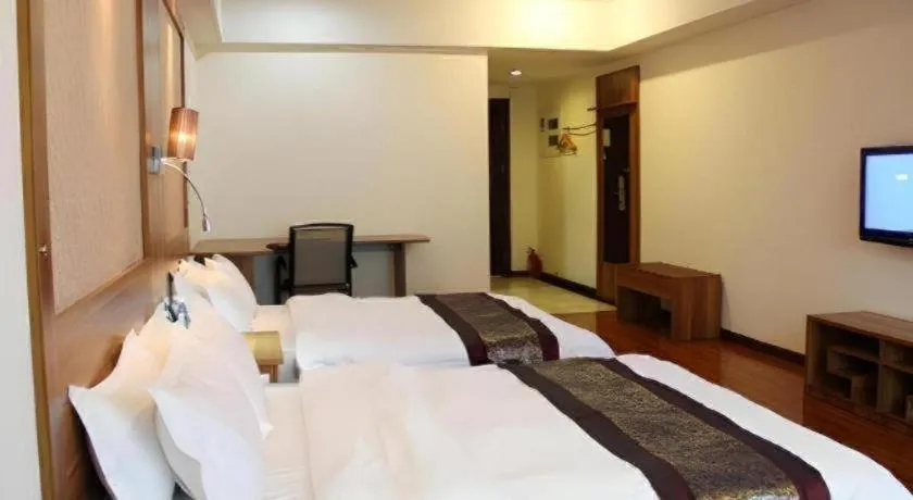 Bed in Chuanghui Business Hotel