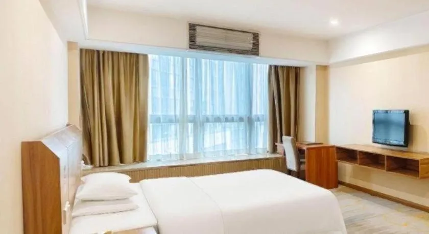 Bed in Chuanghui Business Hotel