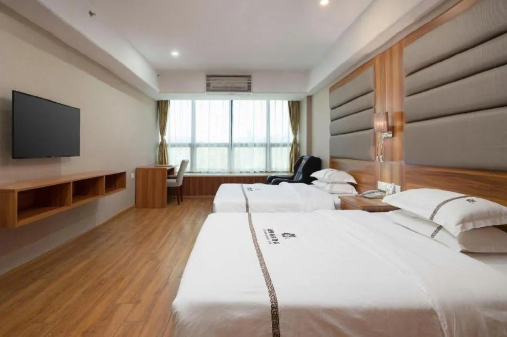 Bed in Chuanghui Business Hotel