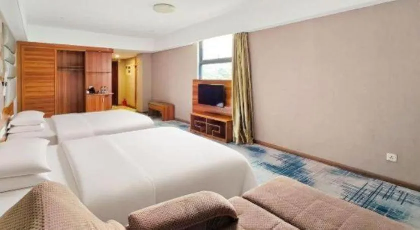 Bed in Chuanghui Business Hotel