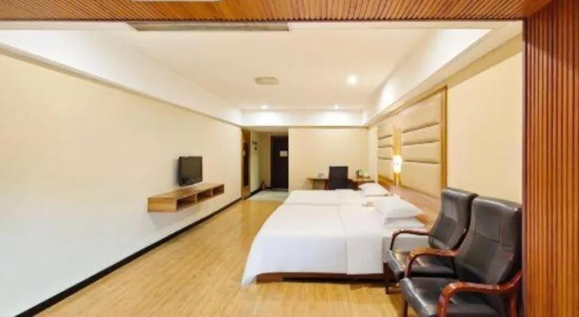 Bed in Chuanghui Business Hotel