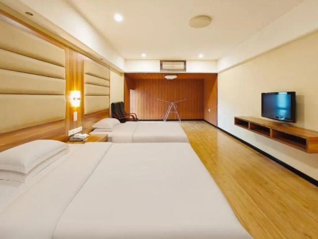 Bed in Chuanghui Business Hotel