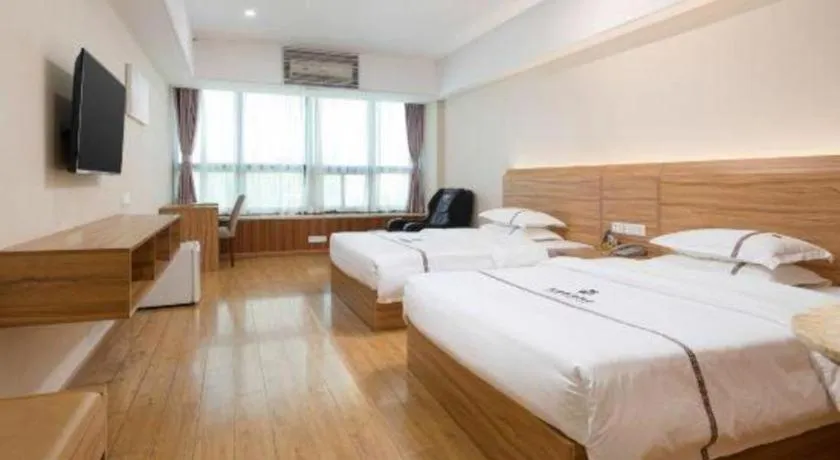 Bed in Chuanghui Business Hotel