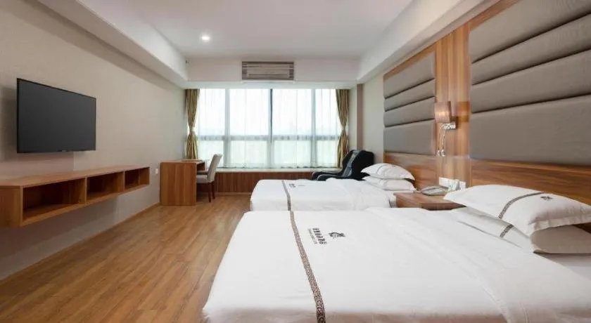 Bed in Chuanghui Business Hotel