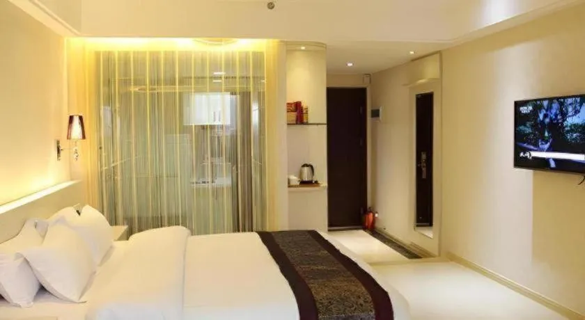 Bed in Chuanghui Business Hotel