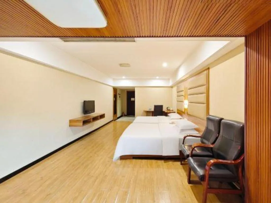 Bed in Chuanghui Business Hotel