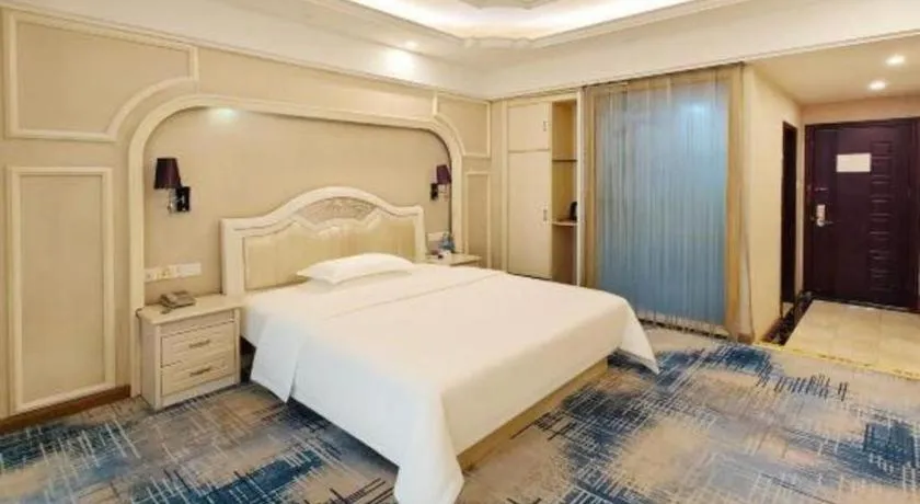 Bed in Chuanghui Business Hotel