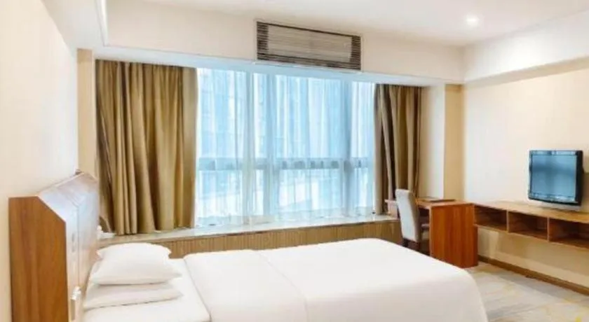 Bed in Chuanghui Business Hotel