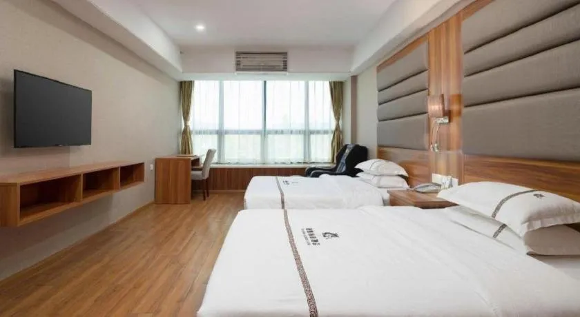 Bed in Chuanghui Business Hotel