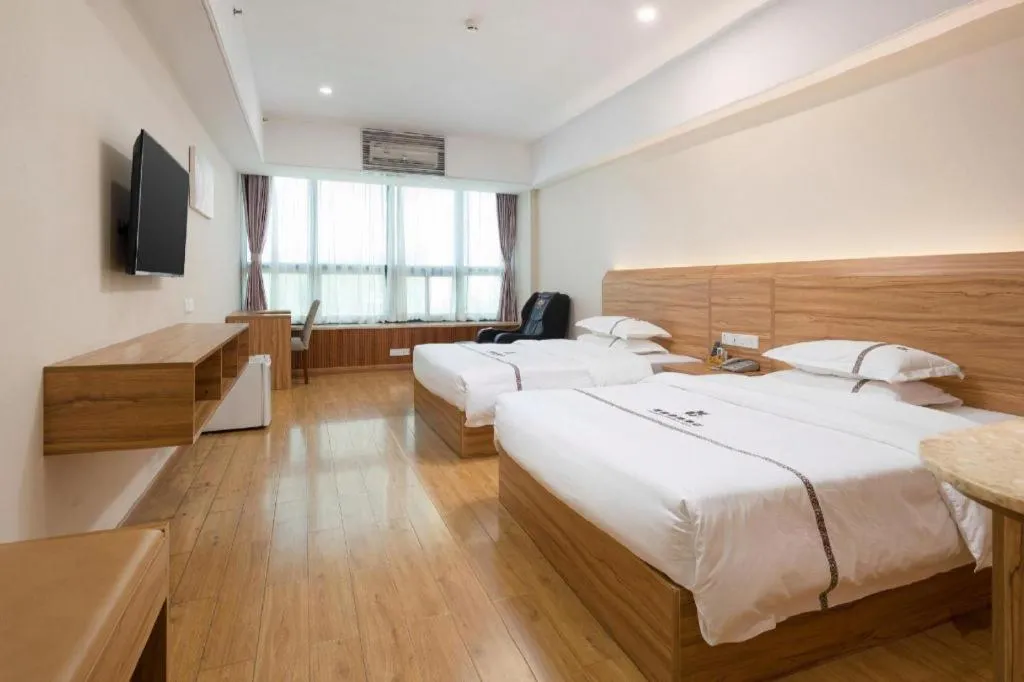 Bed in Chuanghui Business Hotel