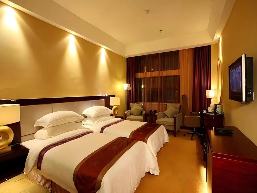 Bed in Chuanghui Business Hotel