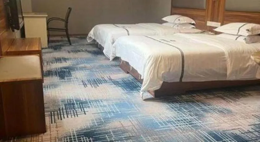 Bed in Chuanghui Business Hotel