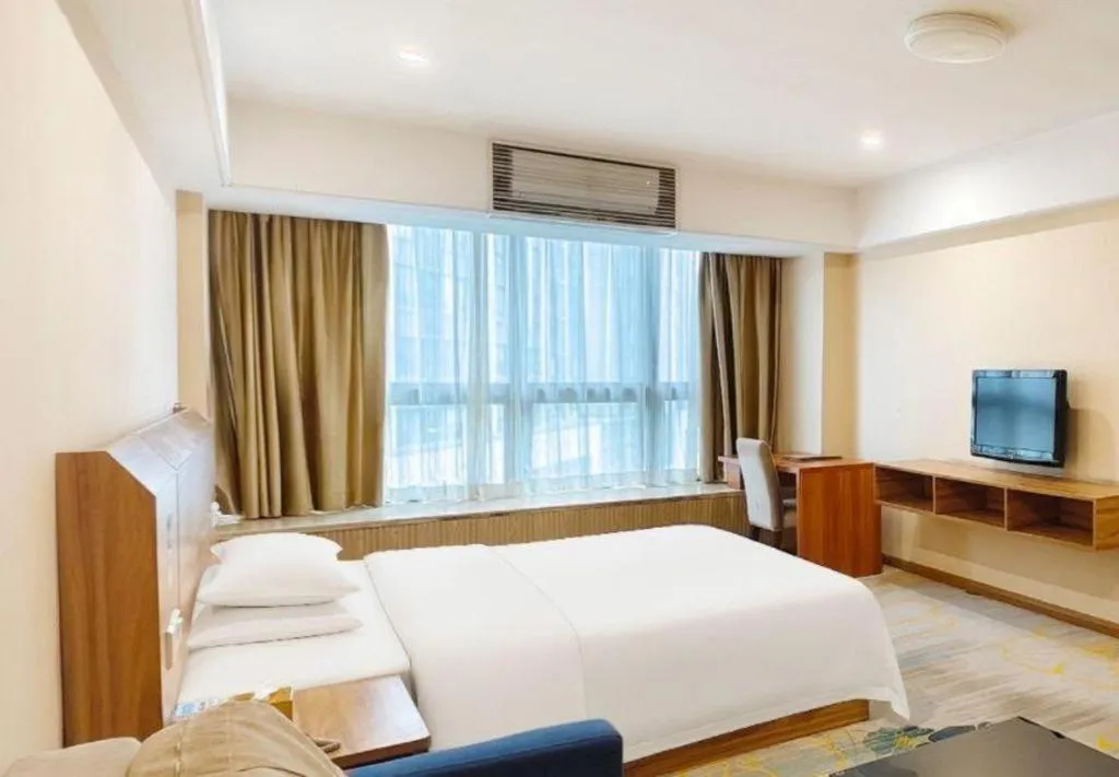 Bed in Chuanghui Business Hotel