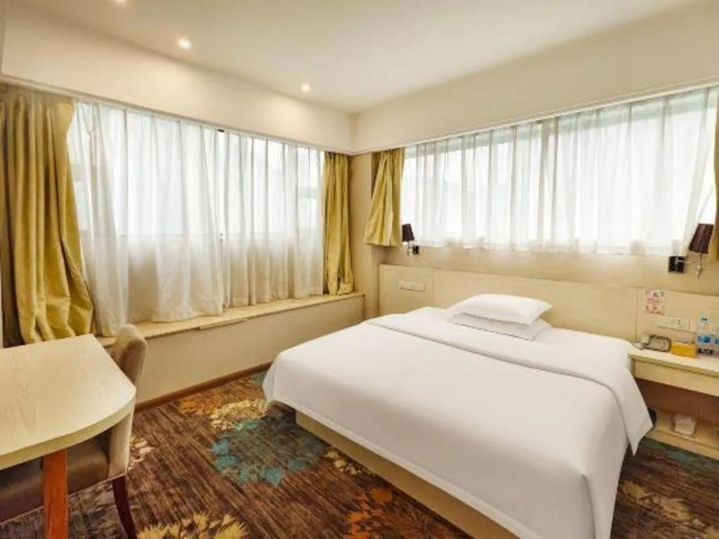 Bed in Chuanghui Business Hotel