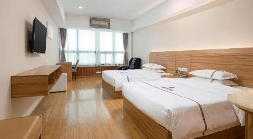 Bed in Chuanghui Business Hotel