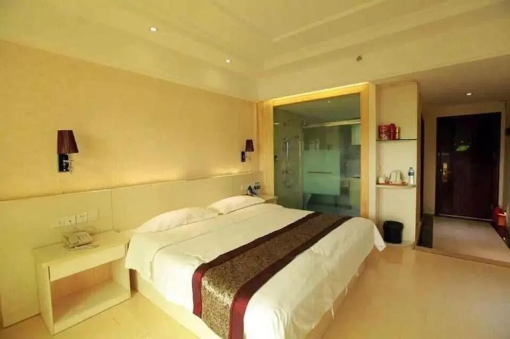 Bed in Chuanghui Business Hotel