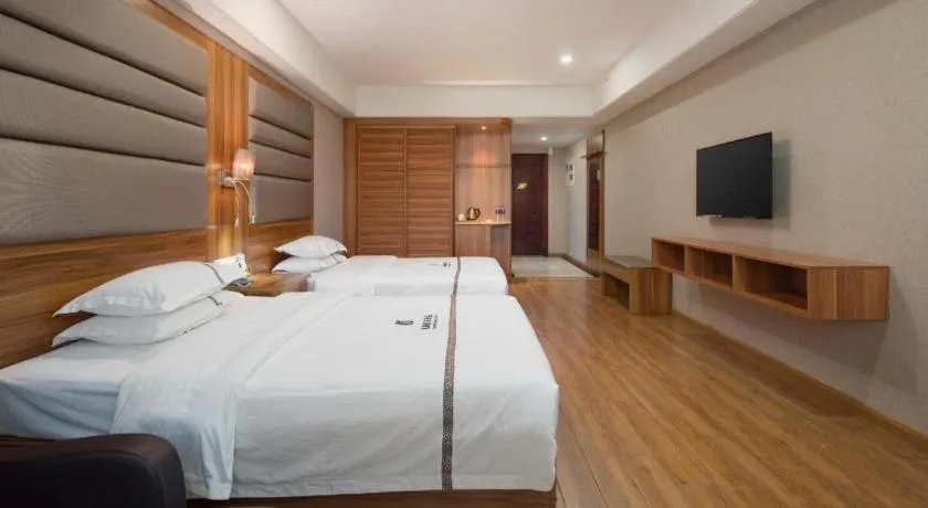 Bed in Chuanghui Business Hotel