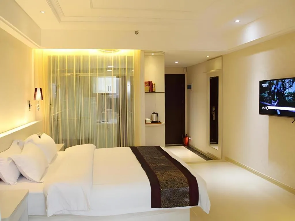 Bed in Chuanghui Business Hotel
