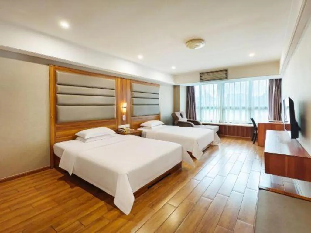 Bed in Chuanghui Business Hotel