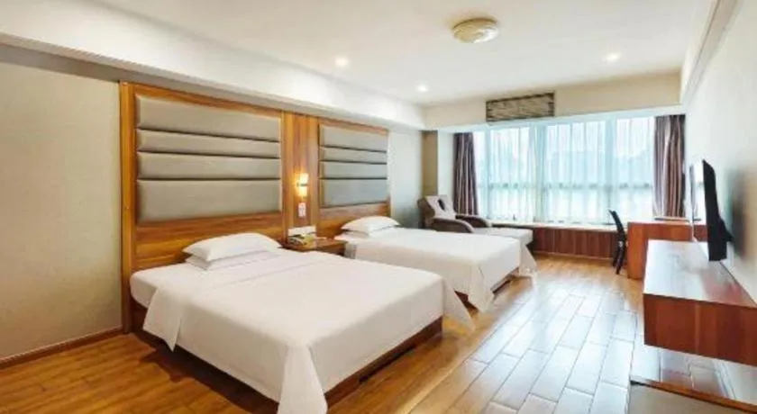 Bed in Chuanghui Business Hotel