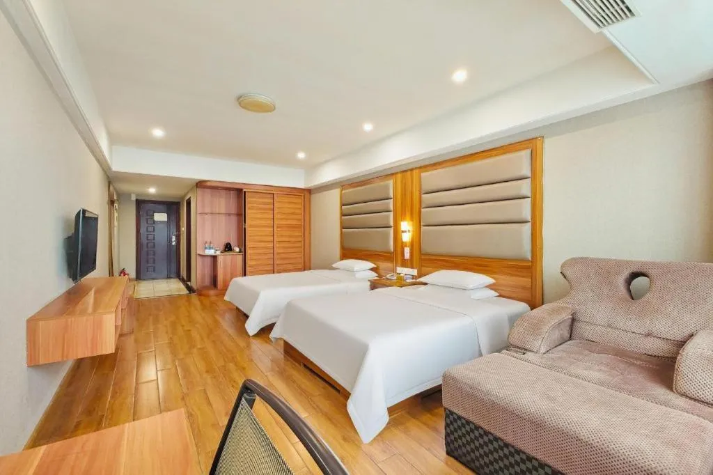 Bed in Chuanghui Business Hotel
