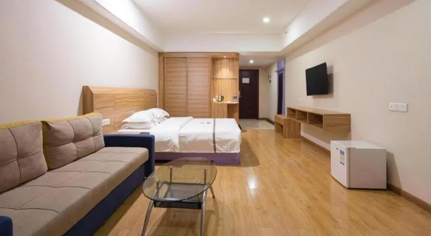 Bed in Chuanghui Business Hotel