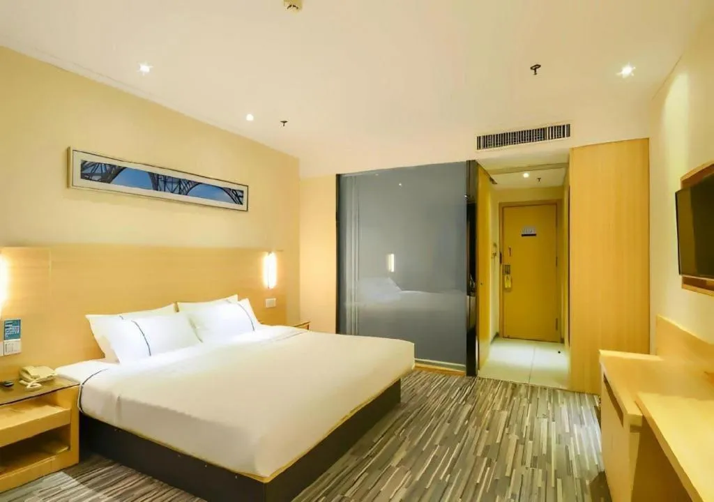 Bed in City Comfort Inn Jingzhou Ancient City Taiyue Road