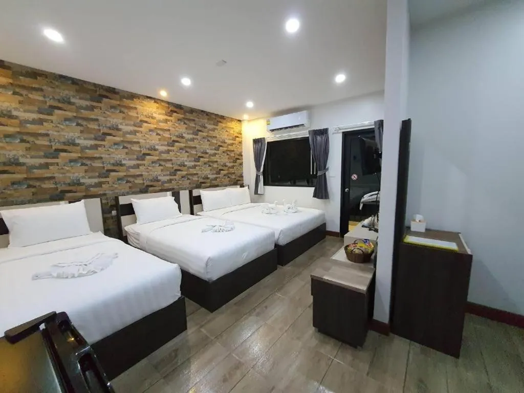 Bed in Rainbow Sky Hotel Samet