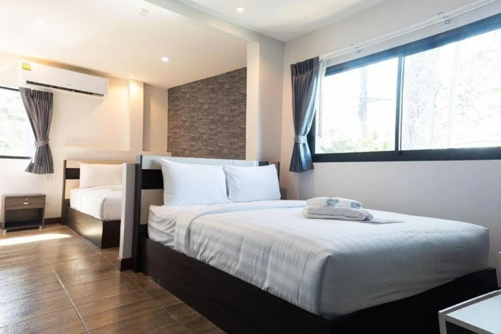 Bed in Rainbow Sky Hotel Samet