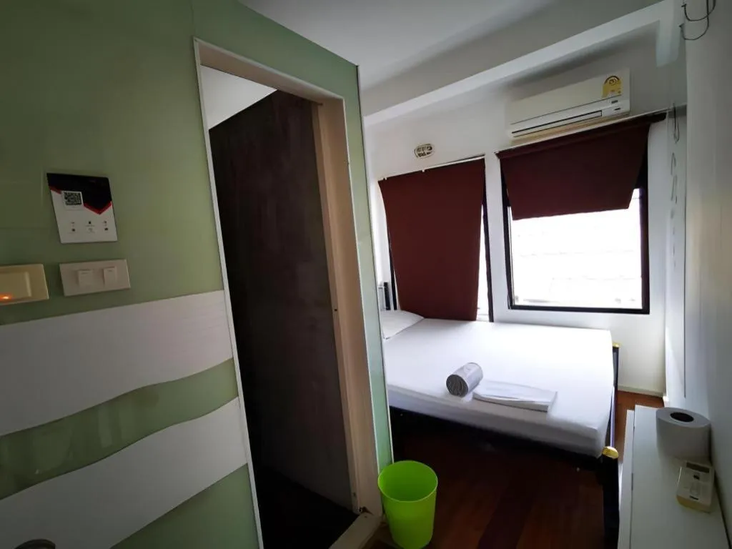 Bed in The Chilli Bangkok Hotel