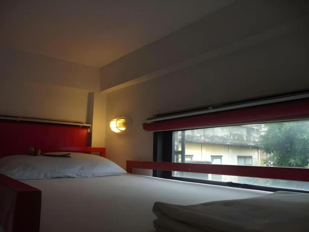 Bed in The Chilli Bangkok Hotel