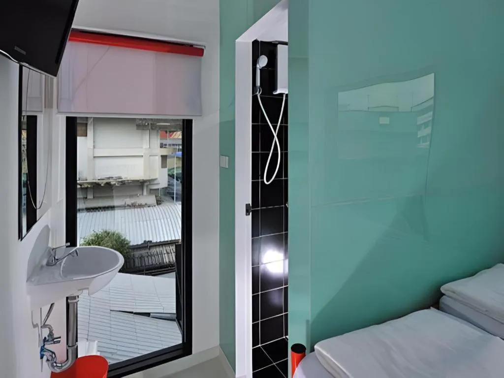 Bed in The Chilli Bangkok Hotel