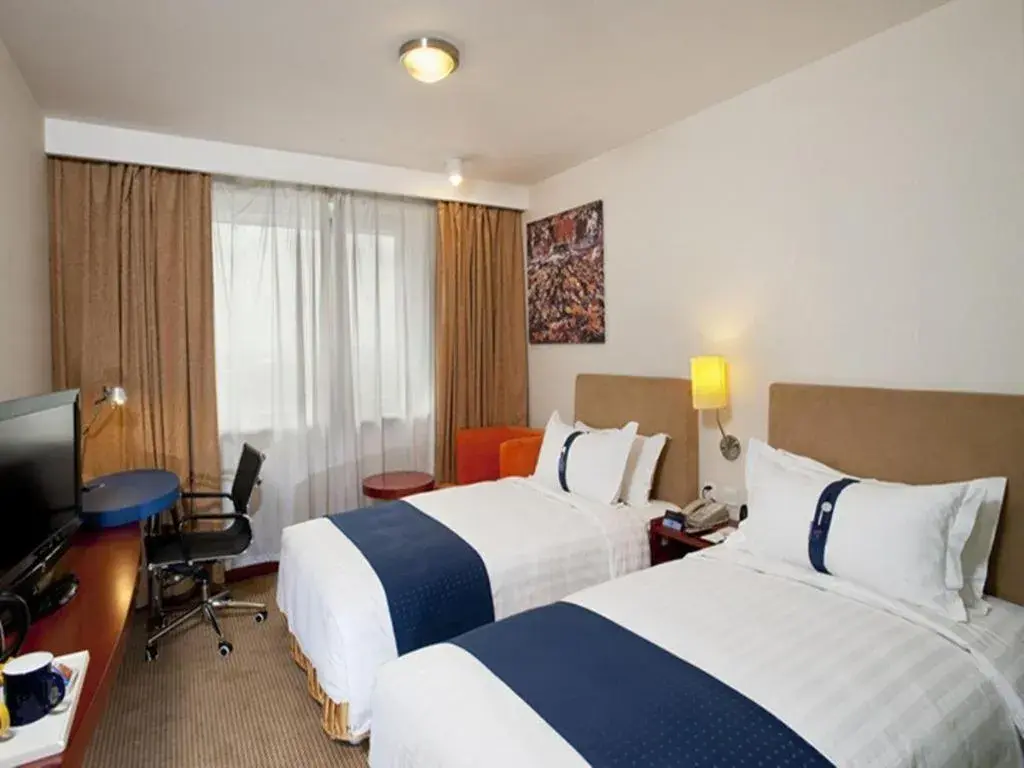 Bed in Holiday Inn Express Tianjin Dongli By IHG Bed in Holiday Inn Express Tianjin Dongli By IHG