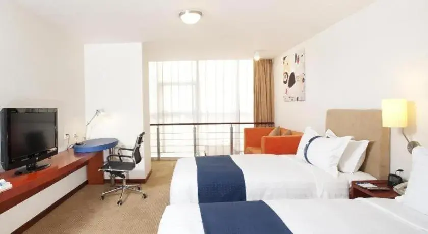 Bed in Holiday Inn Express Tianjin Dongli By IHG Bed in Holiday Inn Express Tianjin Dongli By IHG