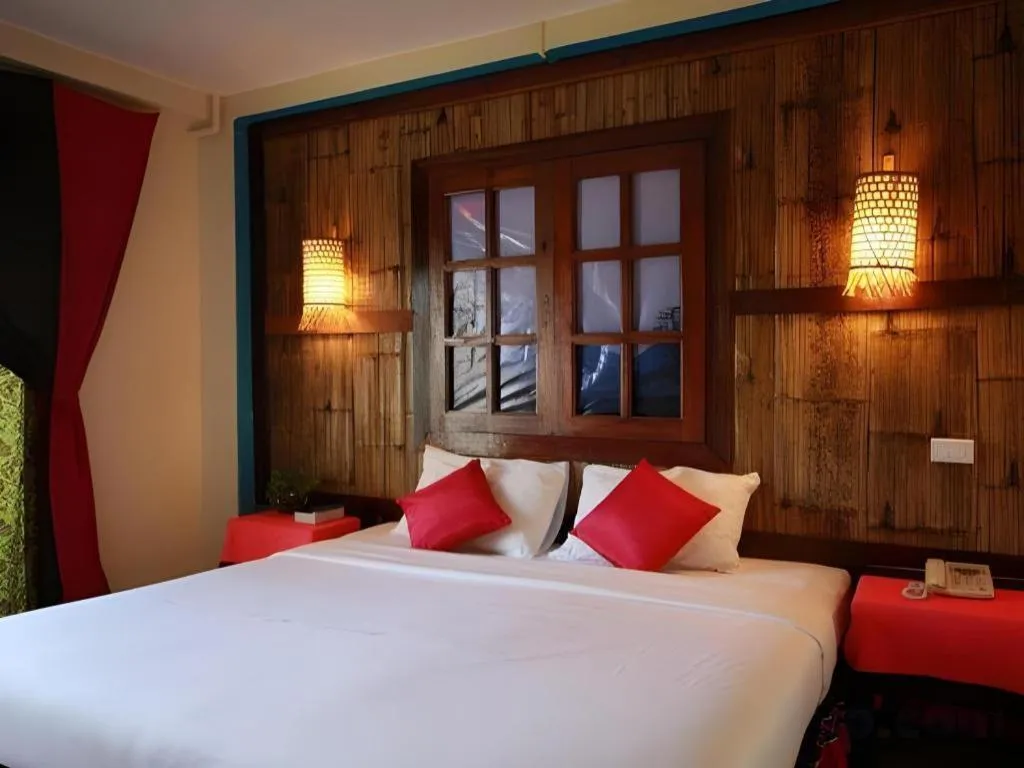 Bed in Phumanee Home Hotel