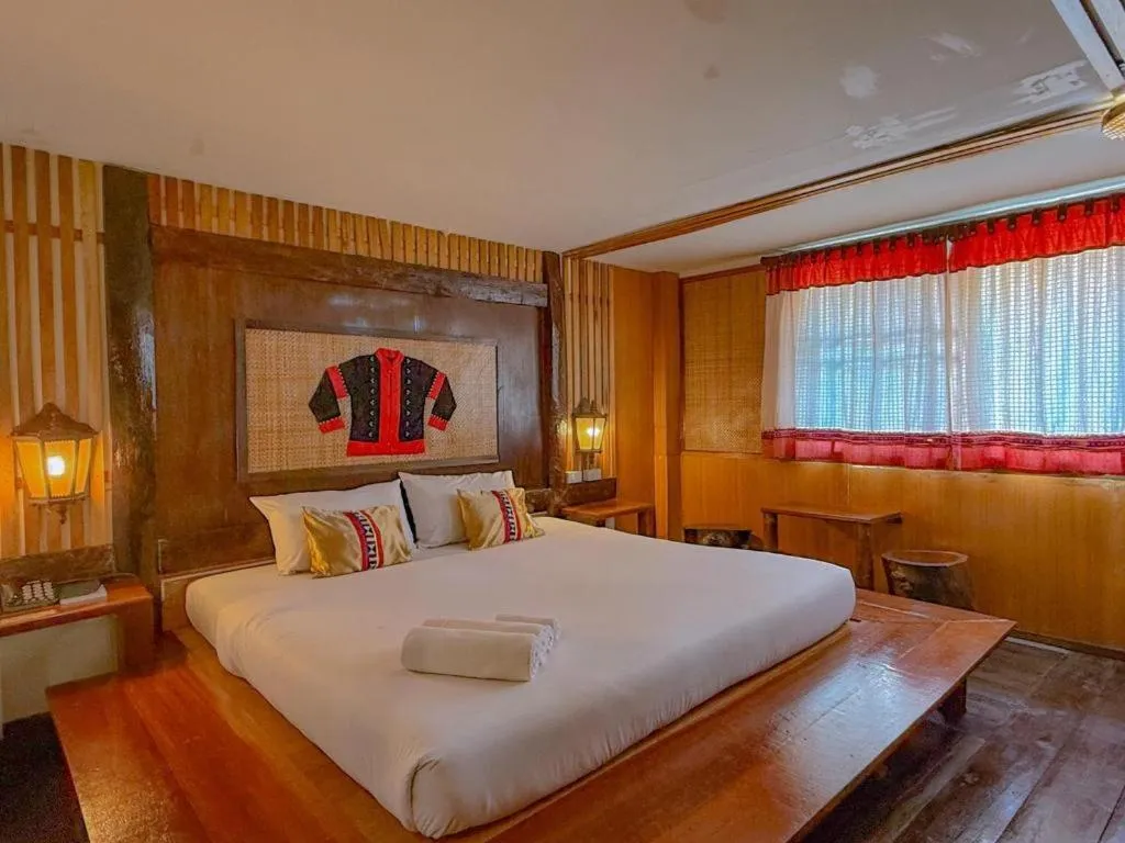 Bed in Phumanee Home Hotel