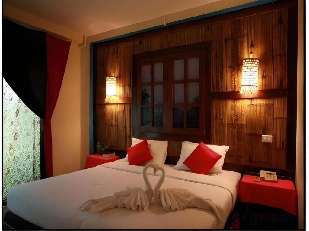 Bed in Phumanee Home Hotel