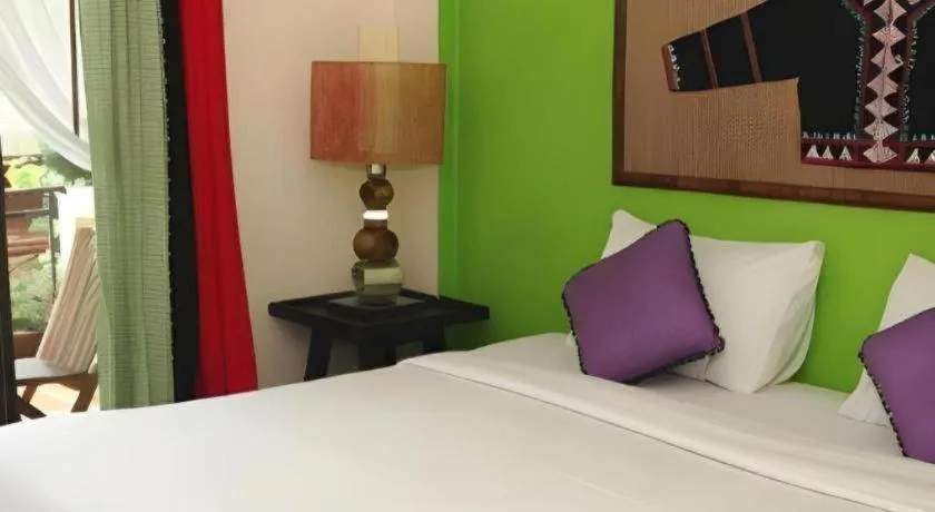 Bed in Phumanee Home Hotel