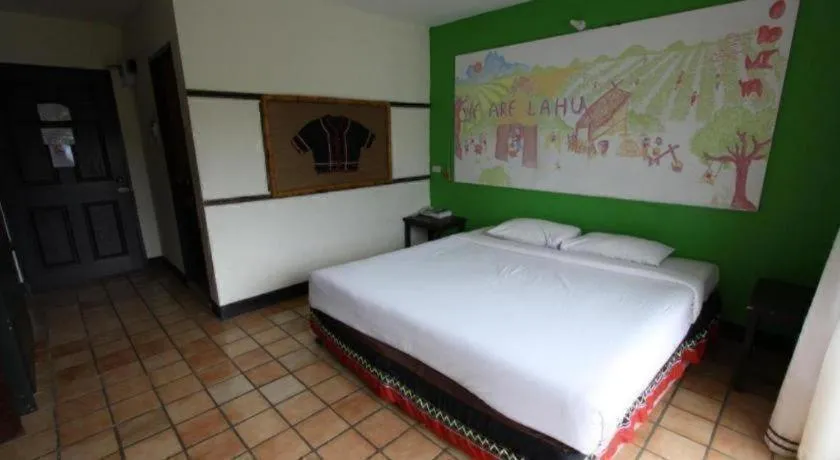 Bed in Phumanee Home Hotel