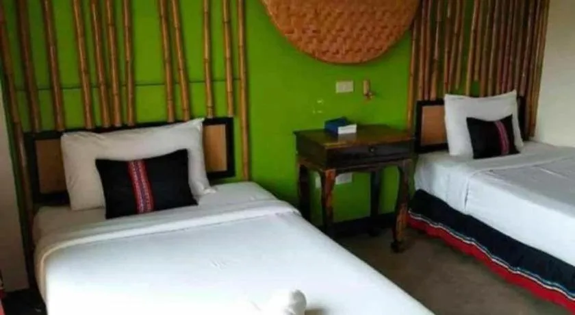 Bed in Phumanee Home Hotel