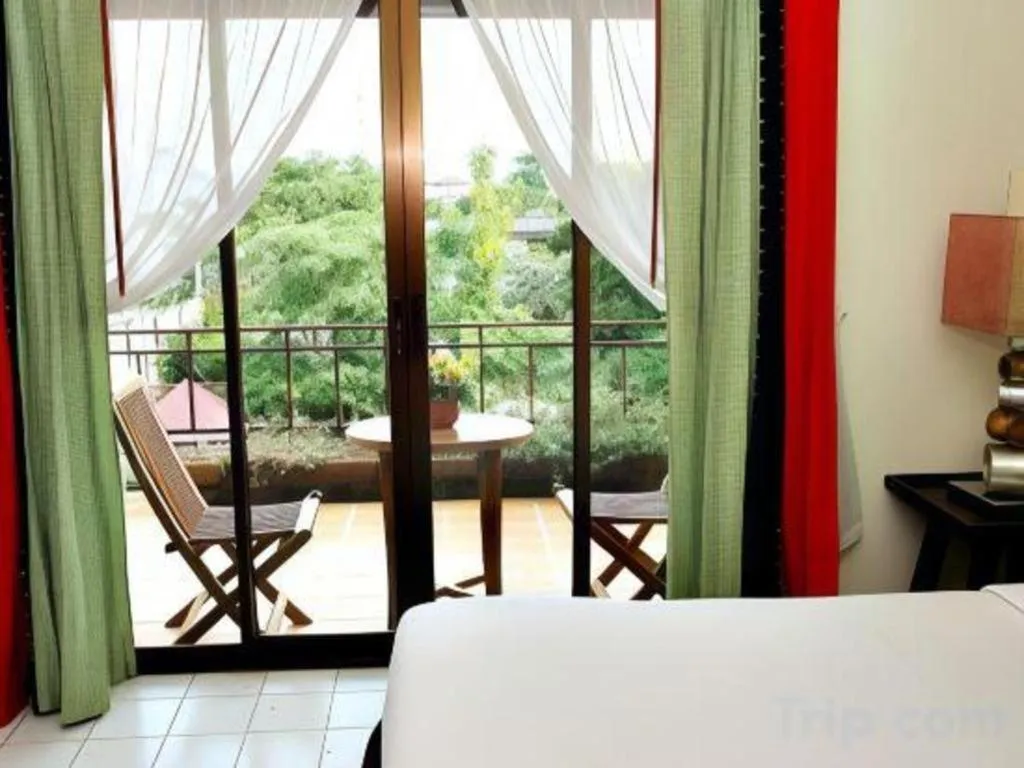 Bed in Phumanee Home Hotel