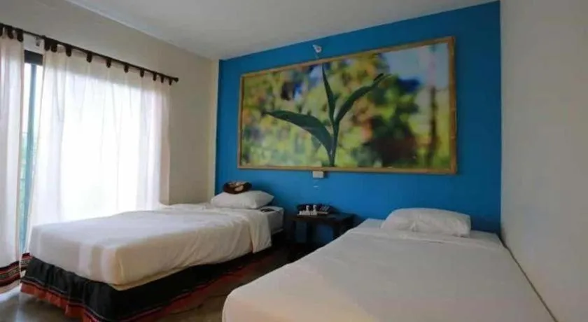 Bed in Phumanee Home Hotel