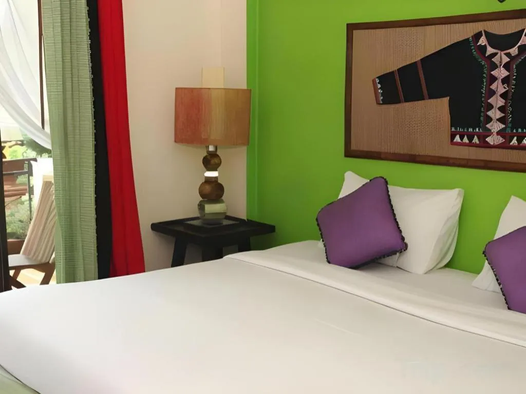 Bed in Phumanee Home Hotel