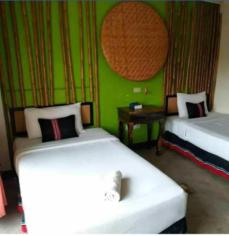 Bed in Phumanee Home Hotel