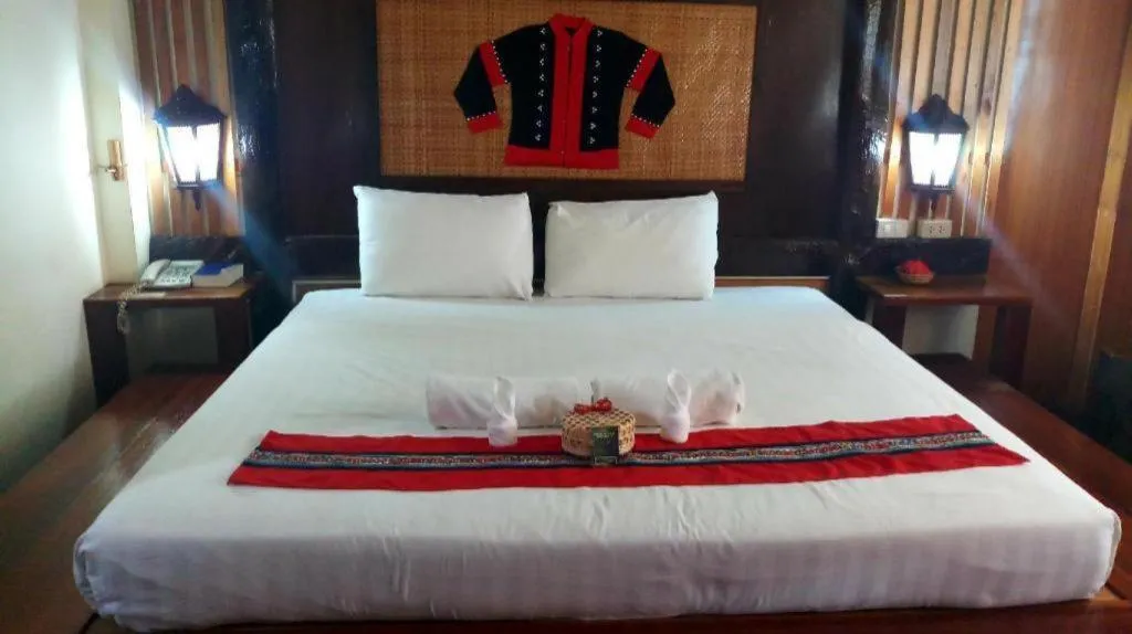 Bed in Phumanee Home Hotel