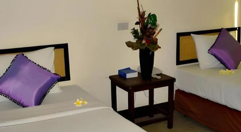 Bed in Phumanee Home Hotel